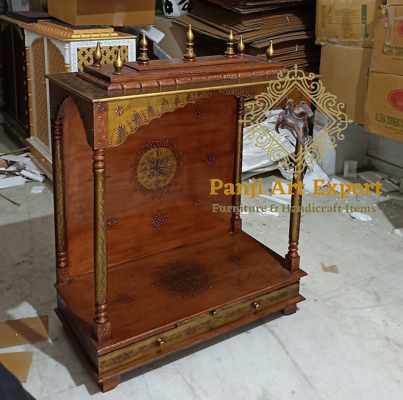 Luxury Handmade Wooden Pooja Mandir crafted from premium quality solid wood with detailed carving, elegant brown finish and devotional diya creating a peaceful spiritual atmosphere. Ideal for Hindu home temples, prayer rooms, meditation corners and festive décor. #LuxuryHomeTemple #WoodenMandirForHome #PoojaMandir #TempleDecor #PrayerCorner #IndianDecor #TraditionalDecor #HomeStyling #WoodCraft #PremiumFurniture