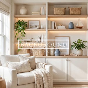 May include: A cozy living room scene with built-in shelving, a comfortable armchair, and a wooden side table. The shelves display books, decorative vases, woven baskets, and framed artwork. The room is bathed in natural light, creating a warm and inviting atmosphere.