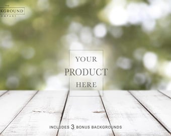 May include: A digital photography backdrop featuring a white wooden plank surface in the foreground and a blurred green nature scene in the background. The text THE BACKGROUND COMPANY appears in the top left, with YOUR PRODUCT HERE in the center.