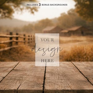 May include: A rustic wooden table with a blurred background of a rural landscape. The scene includes a wooden fence, buildings, and fields. The text "YOUR design HERE" is overlaid on the image, suggesting a product mockup or design template.