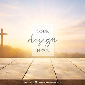 May include: A wooden table surface in the foreground with a sunset background featuring a silhouette of a cross on a hill. A central rectangular frame contains the text YOUR design HERE. The bottom text reads INCLUDES 3 BONUS BACKGROUNDS.