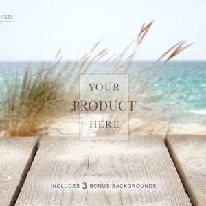 May include: A beach-themed product display background with a wooden boardwalk, sand, and ocean. The text "YOUR PRODUCT HERE" is centered, with "INCLUDES 3 BONUS BACKGROUNDS" below. The Background Company logo is in the upper left.
