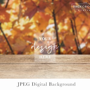 May include: A digital background image featuring a blurred image of autumn leaves in shades of orange, yellow, and red. A wooden table is in the foreground with the text "YOUR design HERE" in a white box.