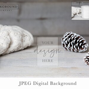 May include: A white knitted blanket, two white-painted pine cones, and a white mug on a light wood background. The text "YOUR design HERE" is superimposed on the image.