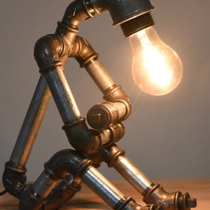 Extravagant lamp made of cast iron, malleable cast iron, vintage, rustic, retro, steampunk, industrial style