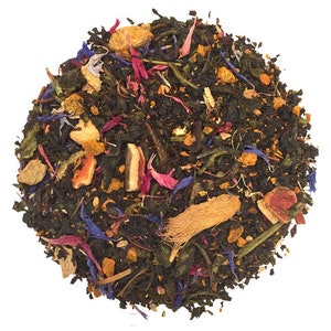 May include: A blend of loose leaf tea with dried fruit, flowers, and spices. The tea includes green tea, orange peel, ginger, turmeric, rose petals, and cornflower petals.