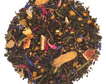 May include: A blend of loose leaf tea with dried fruit, flowers, and spices. The tea includes green tea, orange peel, ginger, turmeric, rose petals, and cornflower petals.