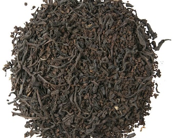May include: A close-up of loose black tea leaves, ideal for brewing a hot cup of tea.