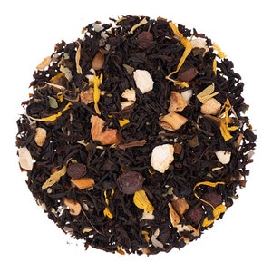 May include: A close-up of a blend of black tea leaves, orange peel, and other dried fruit pieces. The tea is a mix of black, orange, and brown colors.