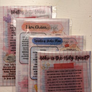 May include: Four stacked devotional study sheets in clear plastic sleeves. Each sheet features a grid background, colorful graphic accents, and titles including Water Into Wine, I am Chosen, Trusting God's Plan, and Who is the Holy Spirit?
