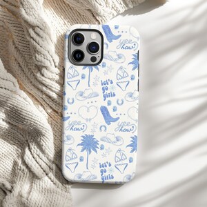 a phone case sitting on top of a bed
