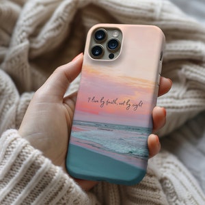 a person holding a phone case with a painting on it