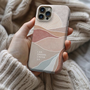 a person holding a cell phone in their hand