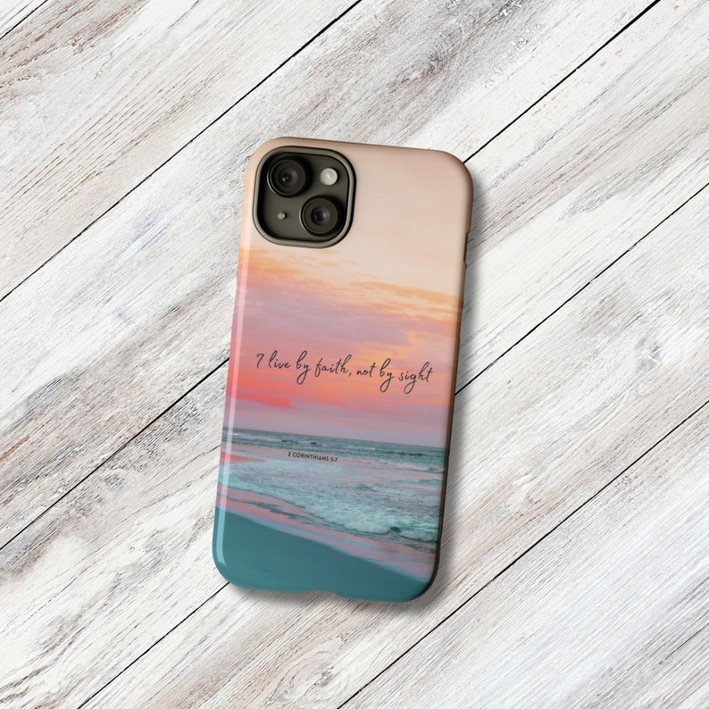 a phone case with a picture of the ocean and a sunset