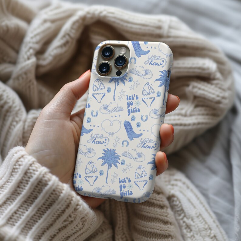 a person holding a cell phone in their hand