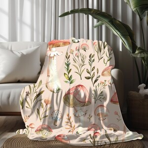 a living room with a couch and a table covered in a blanket