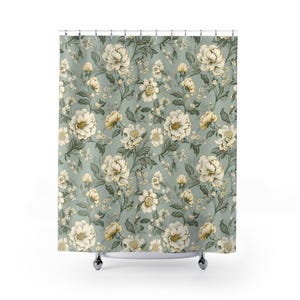 a shower curtain with a floral pattern on it