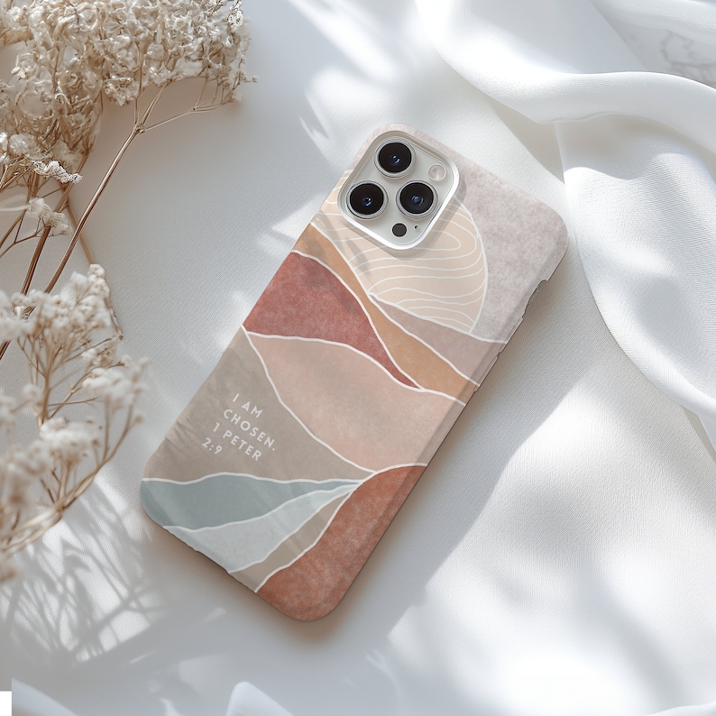a phone case sitting on top of a white sheet