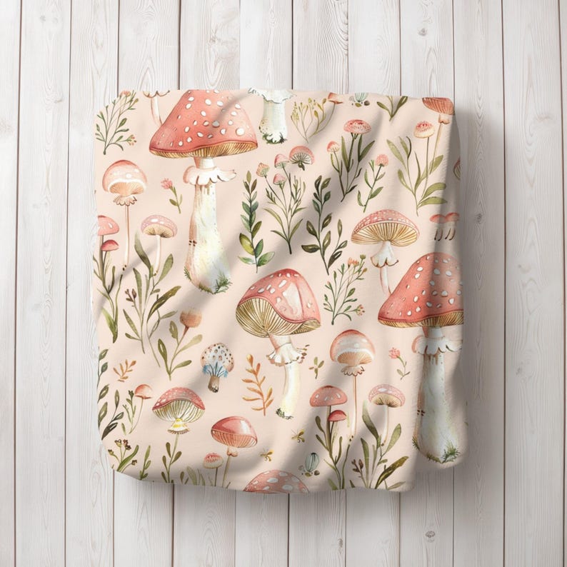 a pink bag with mushrooms and leaves on it