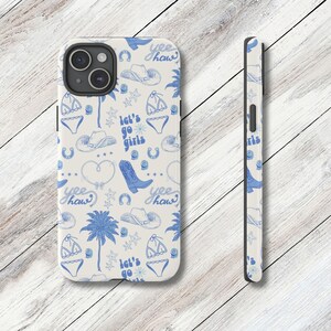 a phone case with a pattern of birds and palm trees