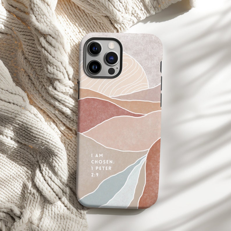 a phone case sitting on top of a white blanket