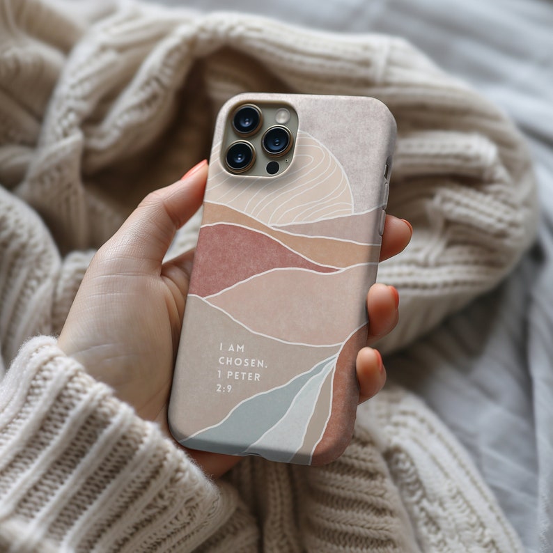 a person holding a cell phone in their hand
