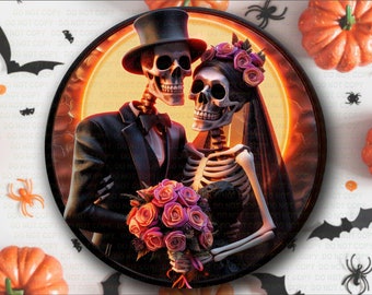 May include: A Halloween image shows a skeleton couple in formal wear, embracing within a circular frame. The male skeleton wears a top hat and tuxedo, while the female skeleton has a veil and floral headpiece. They hold a bouquet of pink roses. Pumpkins and bats surround the frame.