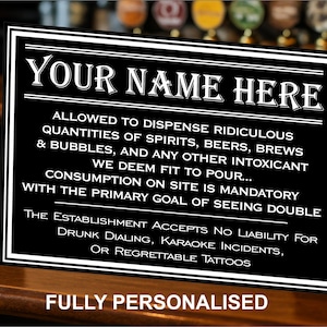 May include: Black rectangular sign with white text, featuring the words "YOUR NAME HERE" and humorous drinking-related phrases. The sign is personalized and suitable for a pub or bar. It is displayed on a wooden surface.