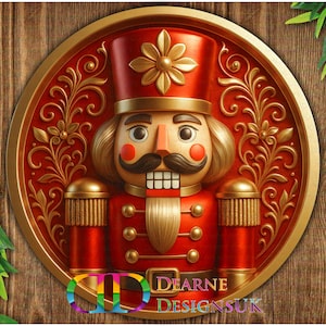 May include: A festive Christmas decoration featuring a red nutcracker soldier with gold detailing. The nutcracker is set within a circular frame with ornate gold patterns on a red background. The text "Dearne Designs UK" is visible at the bottom.