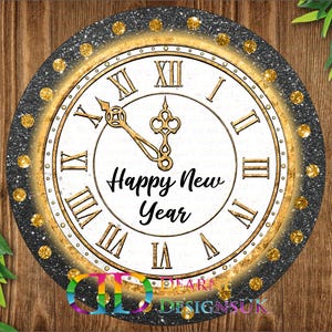 May include: Circular clock face with Roman numerals and gold hands, the words "Happy New Year" are in the centre. The clock has a black glitter border with gold accents and is set against a wooden background.