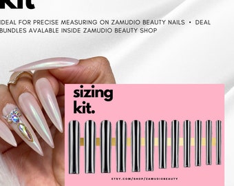 May include: A set of ten silver nail sizing guides with black stripes. The guides are arranged in order of size on a pink background. The text "sizing kit." is written in black on the pink background. The text "ETSY.COM/SHOP/ZAMUDIOBEAUTY" is written in black at the bottom of the image.