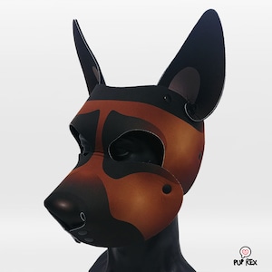 May include: A brown and black dog mask with floppy ears. The mask is made of a soft, flexible material and has a realistic design.
