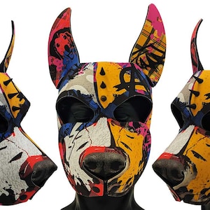 May include: A colorful dog-themed mask with a vibrant, abstract design. The mask features a dog snout and ears, with a mix of red, yellow, blue, and pink patterns. The mask is designed to be worn.