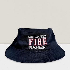May include: A black bucket hat with the text "SAN FRANCISCO FIRE DEPARTMENT" embroidered in white and red.