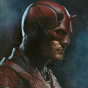 May include: A side profile portrait of a superhero in a red mask with horns. The superhero is wearing a red and black textured suit. The background is a dark blue.