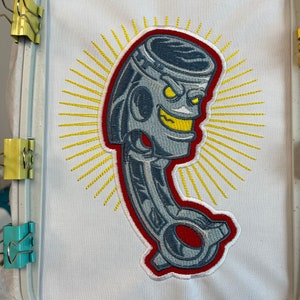 Piston engine part embroidery file. Cool mechanic design. Stitched out real life sample to show details.