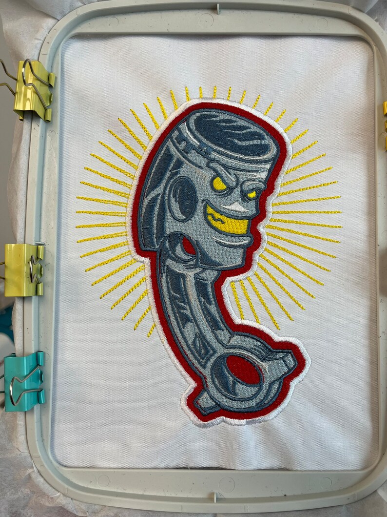 Piston engine part embroidery file. Cool mechanic design. Stitched out real life sample to show details.