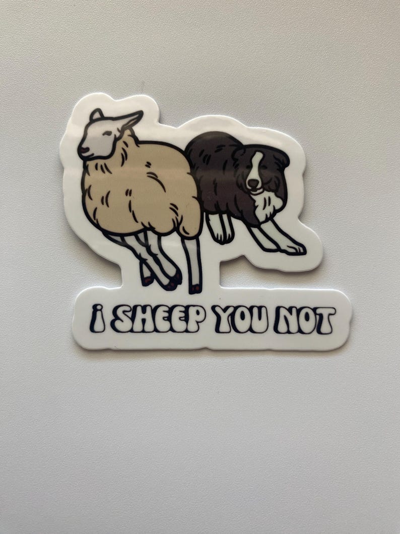 May include: A white sticker with a black and white cartoon image of a sheep and a dog. The text "i sheep you not" is written in black below the image.
