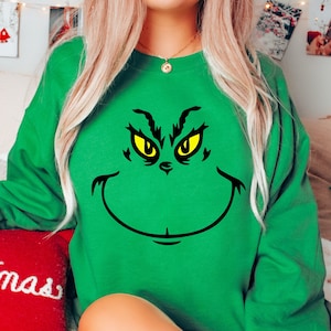 Grinch face sweater discount
