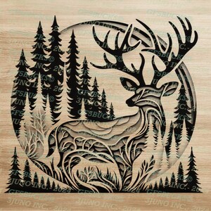 May include: A black and white silhouette of a deer with large antlers standing in a forest. The deer is facing to the right and is surrounded by trees. The image is in a circle shape and is on a wood background.