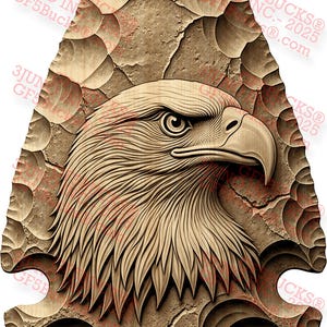 May include: A detailed, carved wooden arrowhead featuring a bald eagle's head. The eagle is depicted in profile, with intricate feather and eye details. The arrowhead is approximately 10 inches long.