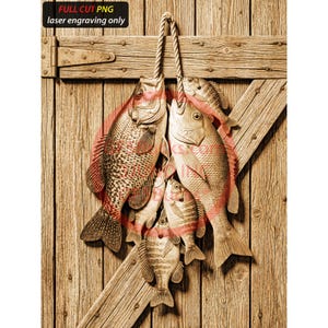 May include: Wooden carving of several fish hanging from a rope against a wooden door. The fish are various sizes and colors, with detailed scales and fins. The text "FULL CUT PNG laser engraving only" is at the top.