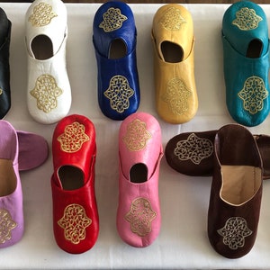 Handmade genuine Moroccan soft leather slippers embroidered with gold hand of Fatima a good luck symbol.