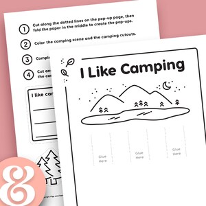 May include: A black and white printable camping scene with instructions to cut, fold, and glue the pop-up elements. The scene includes mountains, a lake, trees, and a crescent moon. The text "I Like Camping" is at the top of the page.