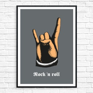 May include: A black and white illustration of a hand making the rock and roll hand gesture. The background is gray and the text "Rock 'n roll" is printed in white below the hand.