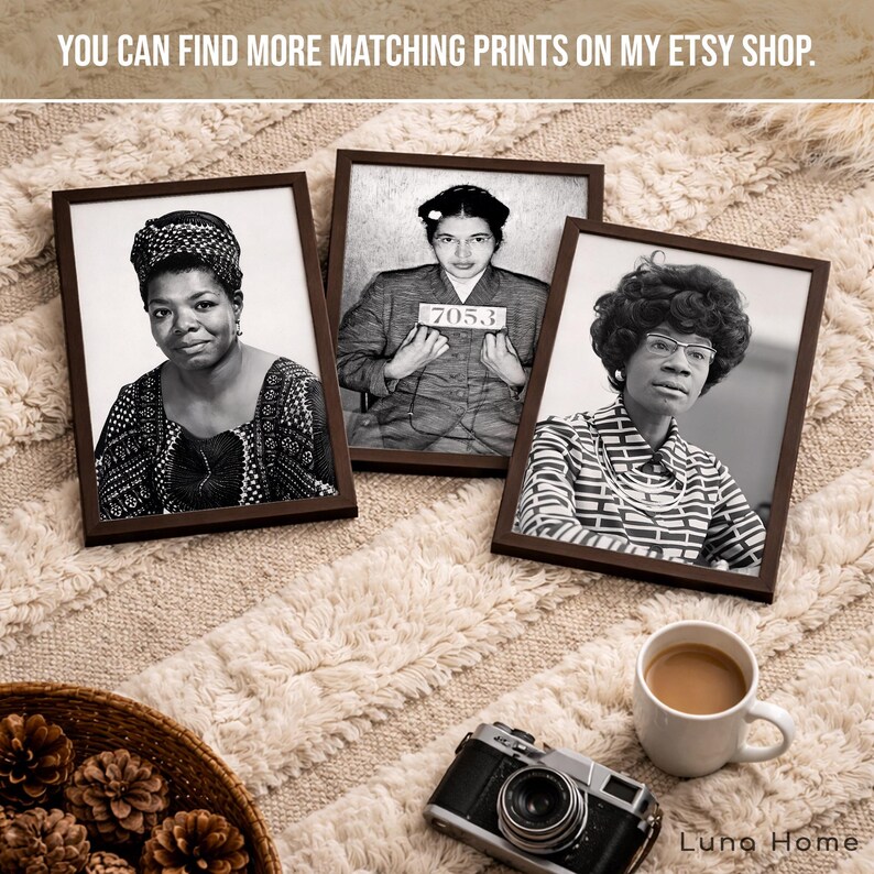 May include: Three rectangular dark brown frames containing black and white portraits of Maya Angelou, Rosa Parks holding a 7053 sign, and Shirley Chisholm. The frames are arranged on a textured surface with a camera and a white mug.