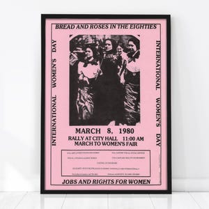 May include: Pink poster with black text and a black and white image of women. The poster reads "Bread and Roses in the Eighties" and "International Women's Day." It announces a rally on March 8, 1980, with the text "Jobs and Rights for Women."