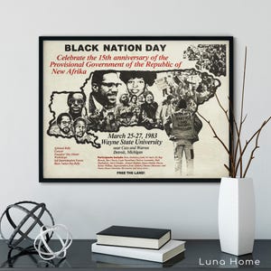May include: A framed poster with the text "BLACK NATION DAY" and "Celebrate the 15th anniversary of the Provisional Government of the Republic of New Afrika." The poster includes images of people and text about an event at Wayne State University.