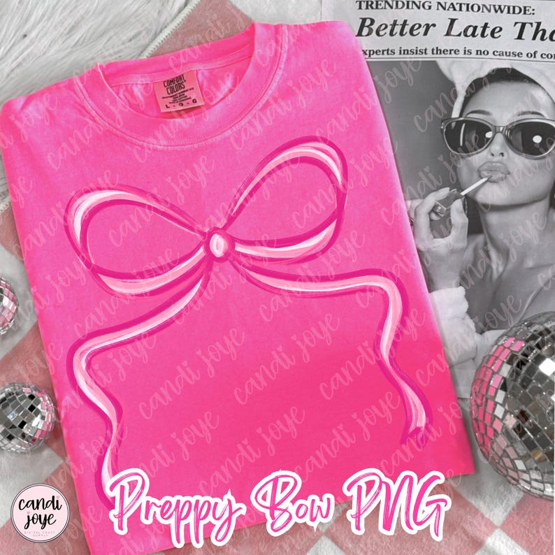 May include: A vibrant pink t-shirt featuring a large bow design in pink and white. The text "Preppy Bow PNG" is at the bottom. The shirt is a Comfort Colors brand. A black and white image of a woman is in the background.