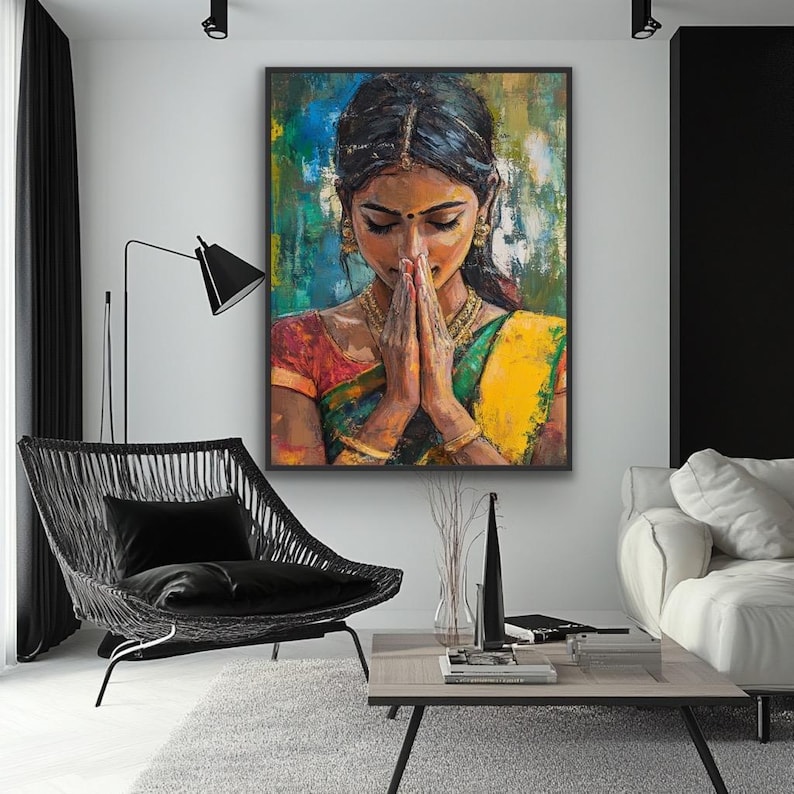 Indian wall art    Indian woman painting Indian namaste wall art -  May include: An oil painting of a woman in traditional Indian attire, with hands clasped in prayer. The artwork features a vibrant color palette of yellow, green, red, and blue. The woman is adorned with gold jewelry, and the painting is framed in black.